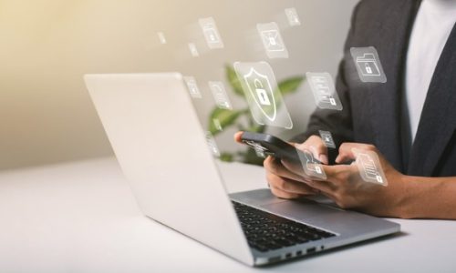 a-businessman-works-on-his-laptop-at-home-with-a-virtual-display-showing-a-symbol-to-signify.jpg_s=1024x1024&w=is&k=20&c=e7uAzHv3zDz9Q0pn0NQpJX8l7Ef1Us0ATJLdT6bVjP0=