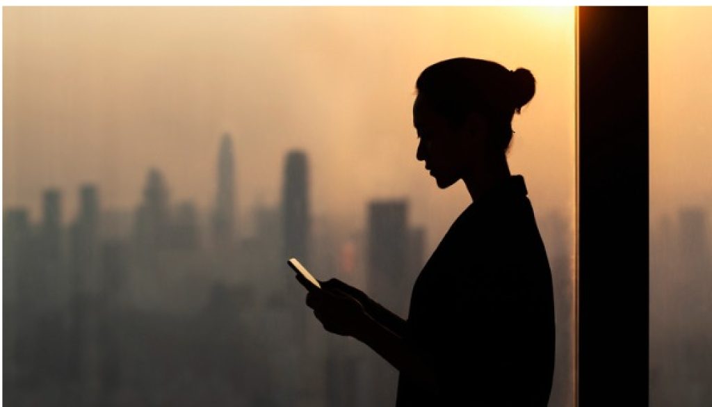 silhouette-of-young-woman-using-smartphone-next-to-window-with-cityscape.jpg_s=1024x1024&w=is&k=20&c=6zRwywGYg6qdC0Yj14DdEWH-E8IJ38wVP2kGV6hNMz0=