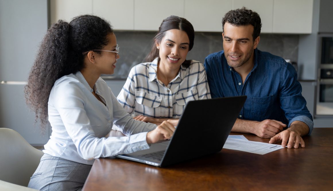 Couple talking to a financial advisor about an investment