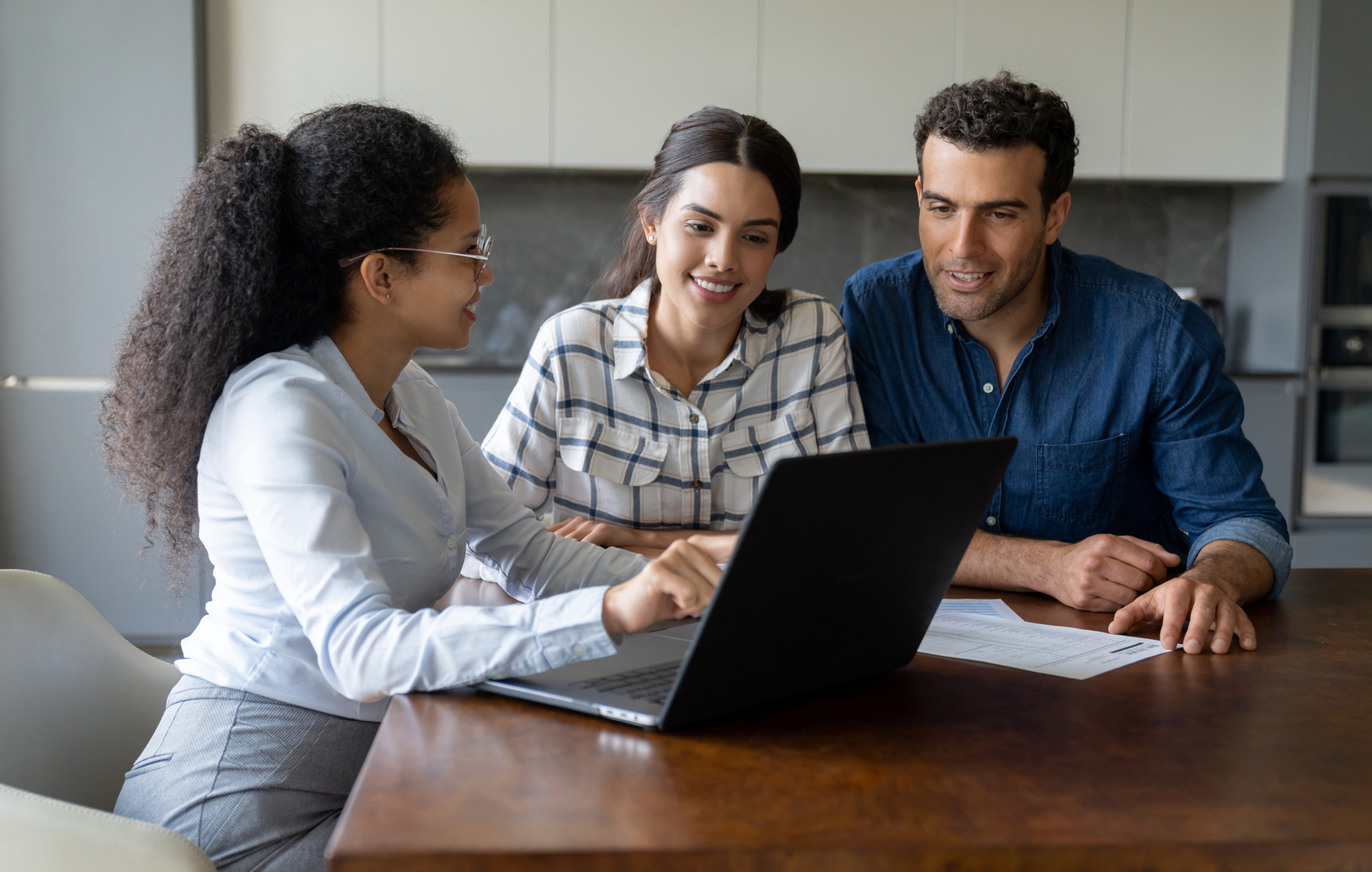 Couple talking to a financial advisor about an investment