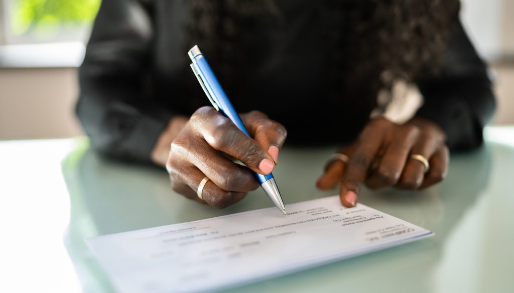 African Woman Writing Check